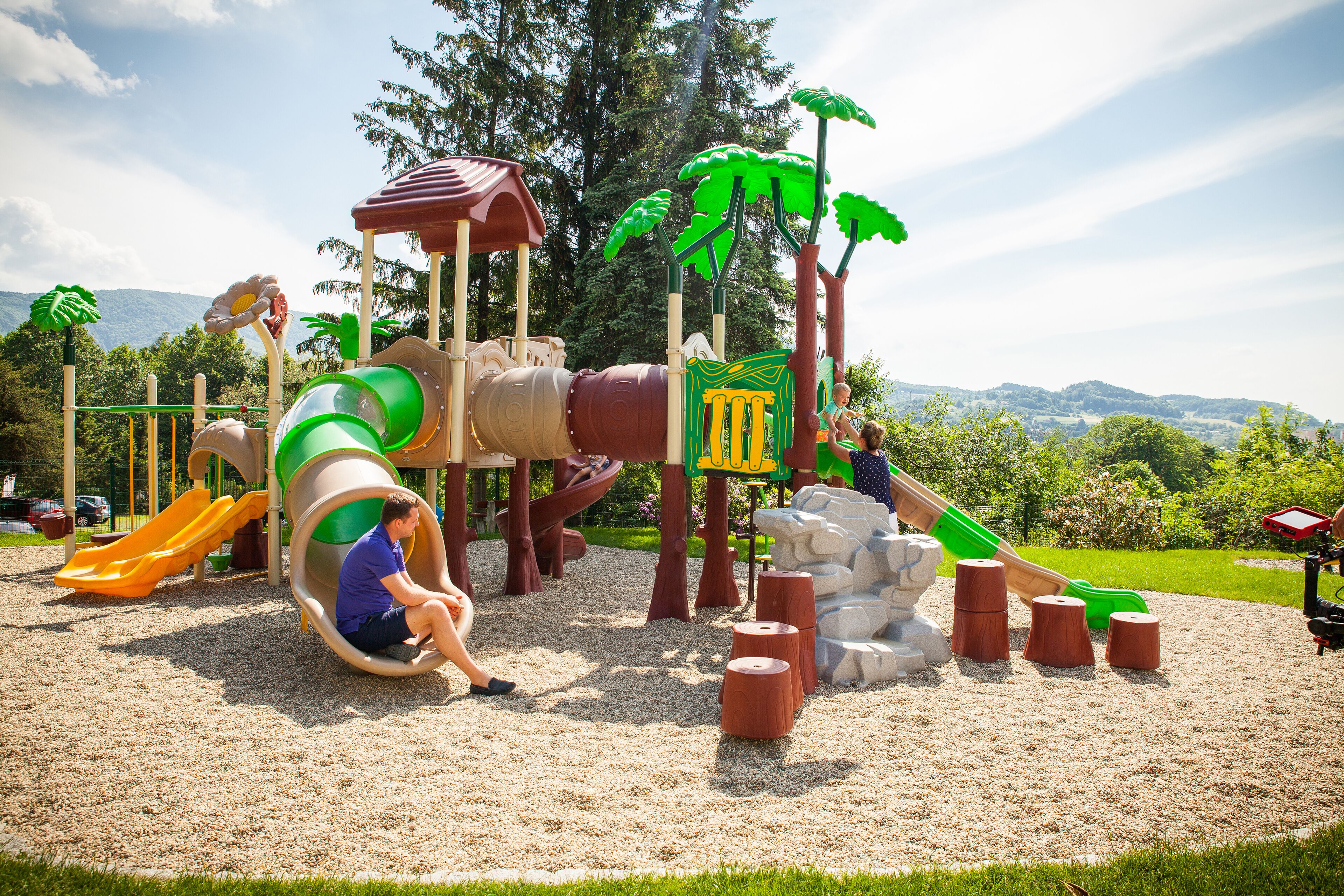 A playground with slides and climbing structures.