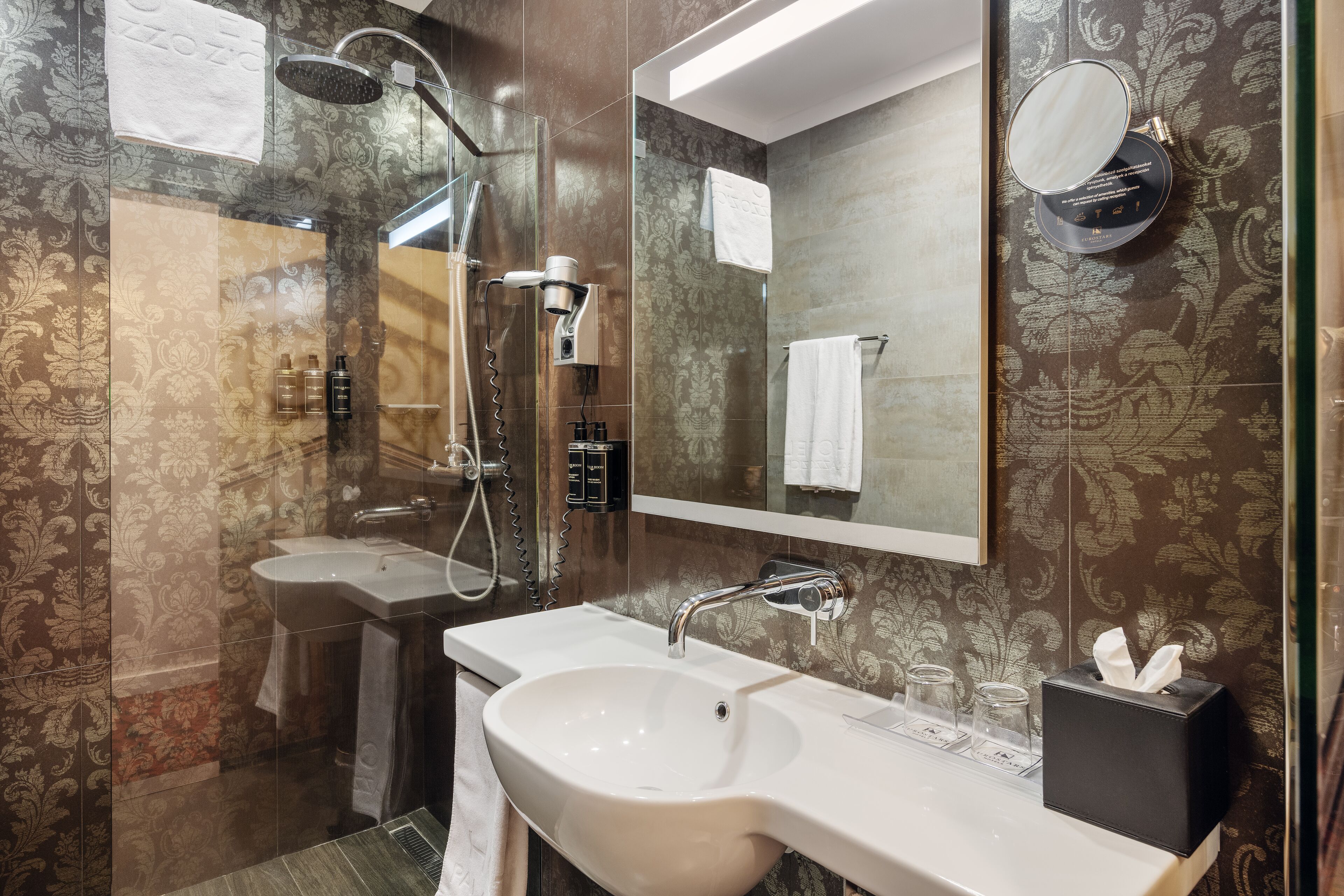deluxe room | bathroom | shower, eco-friendly toiletries, hair dryer, slippers