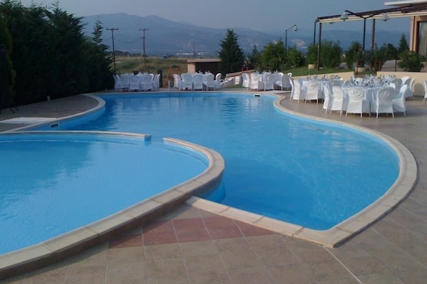Outdoor pool, pool umbrellas, sun loungers
