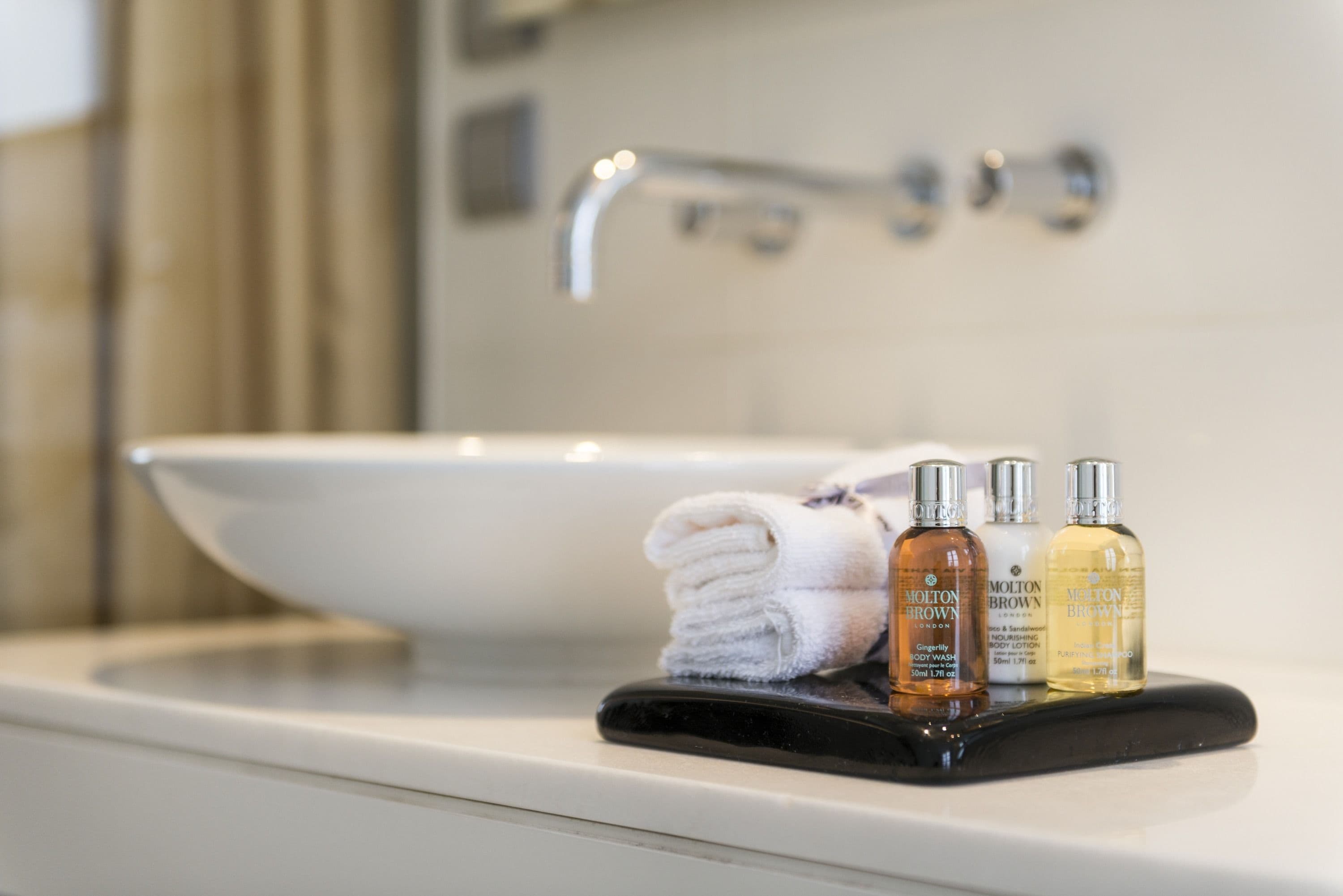 bathtub, designer toiletries, hair dryer, bathrobes