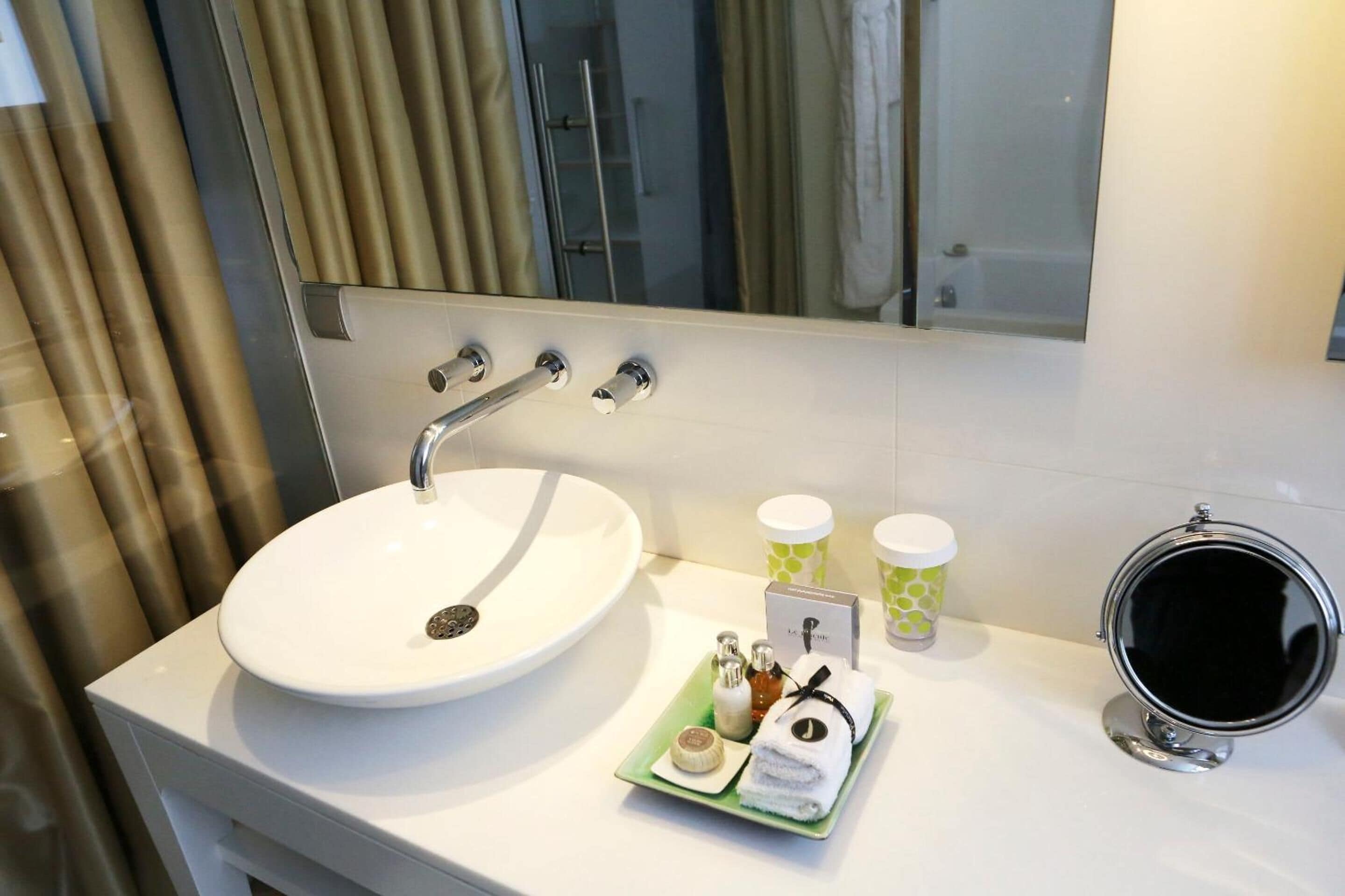 bathtub, designer toiletries, hair dryer, bathrobes