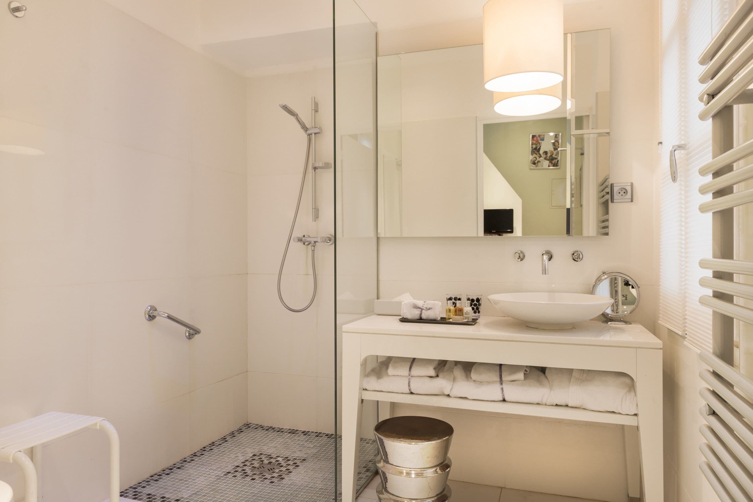 duplex | bathroom | bathtub, designer toiletries, hair dryer, bathrobes
