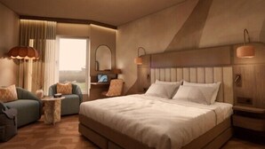 Habitación de hotel con una cama grande, dos sillones, una mesita, una mesita de noche, una lámpara y una ventana con cortinas.