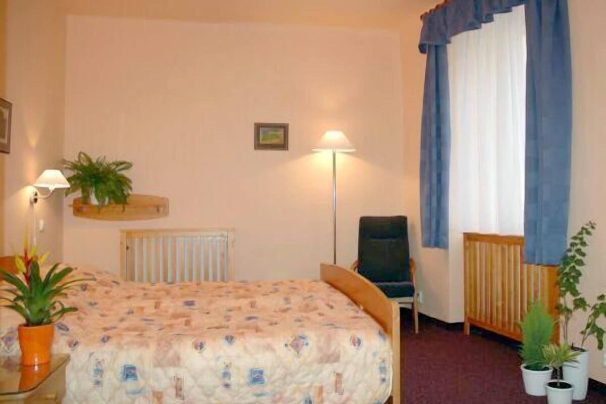 Standard Triple Room | Minibar, in-room safe, desk, blackout drapes