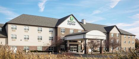 A Holiday Inn Express hotel with a covered entrance and multiple windows.
