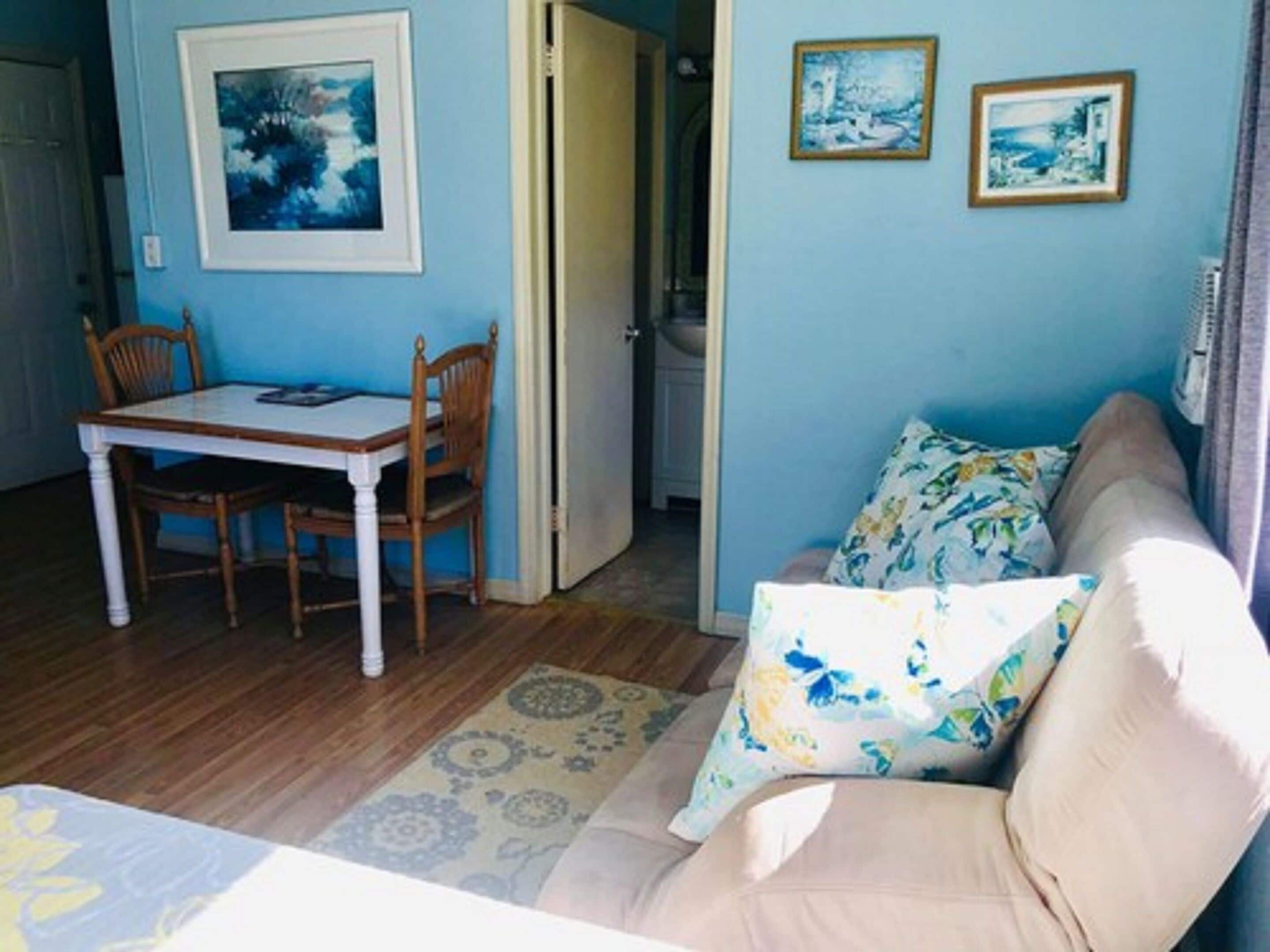 standard room, 2 double beds, non smoking | living area | tv