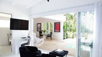 Romantic Suite, Beachfront | Living area | Smart TV