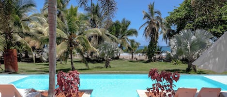 3 outdoor pools, open 8:00 AM to 9:00 PM, pool umbrellas, pool loungers