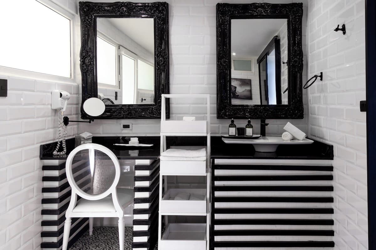 romantic suite, beachfront | bathroom | shower, rainfall showerhead, hair dryer, towels