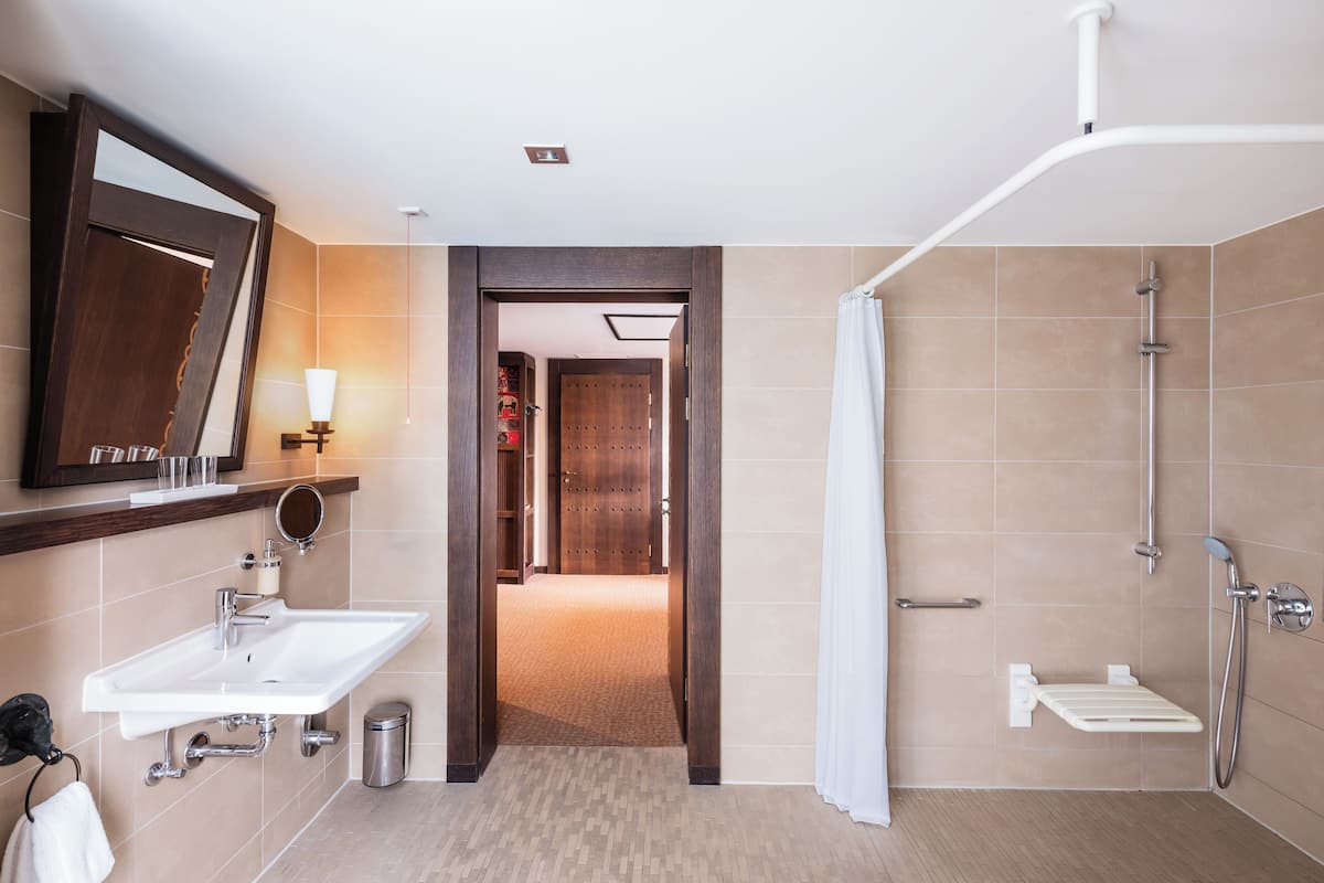 Deluxe Double Room, Mobility Accessible | Bathroom | Shower, rainfall showerhead, hair dryer, bathrobes