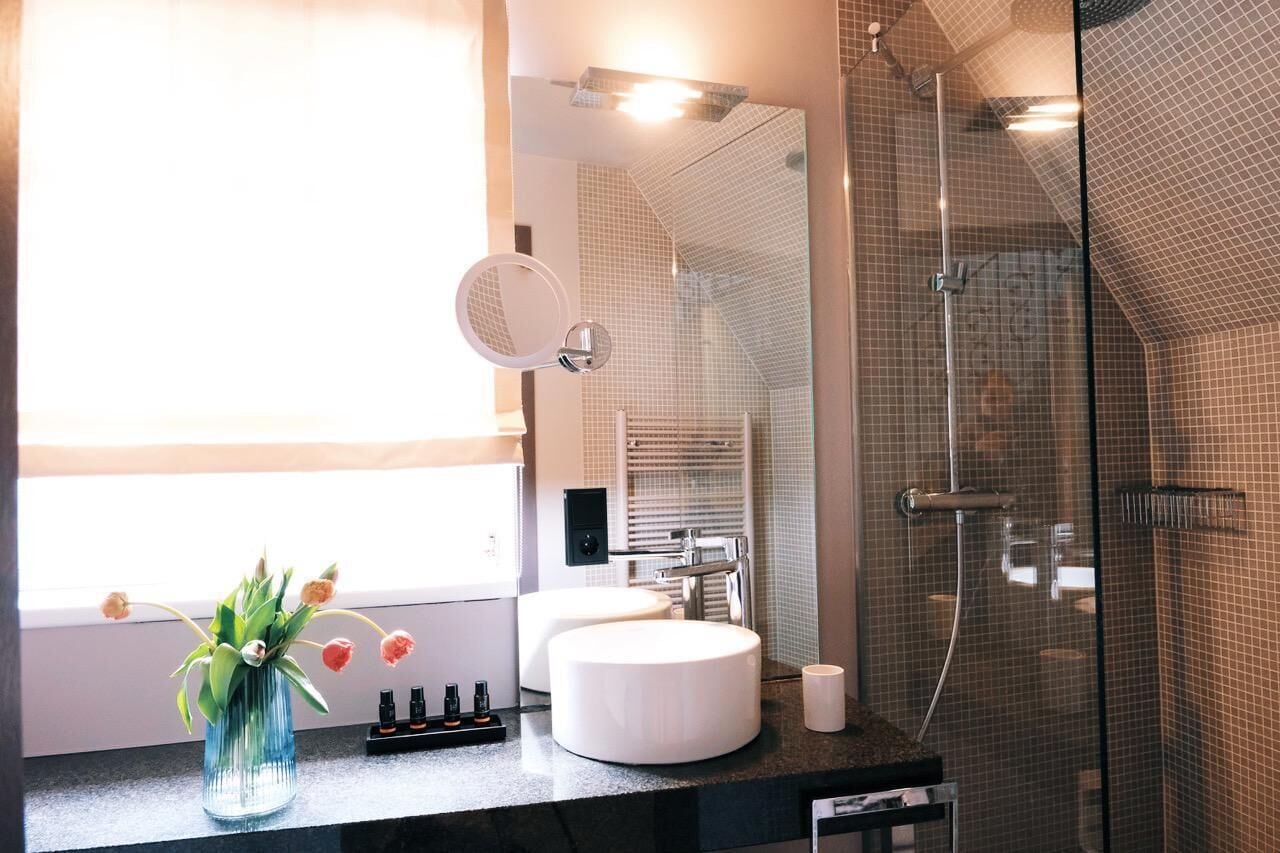 designer toiletries, hair dryer, bathrobes, slippers