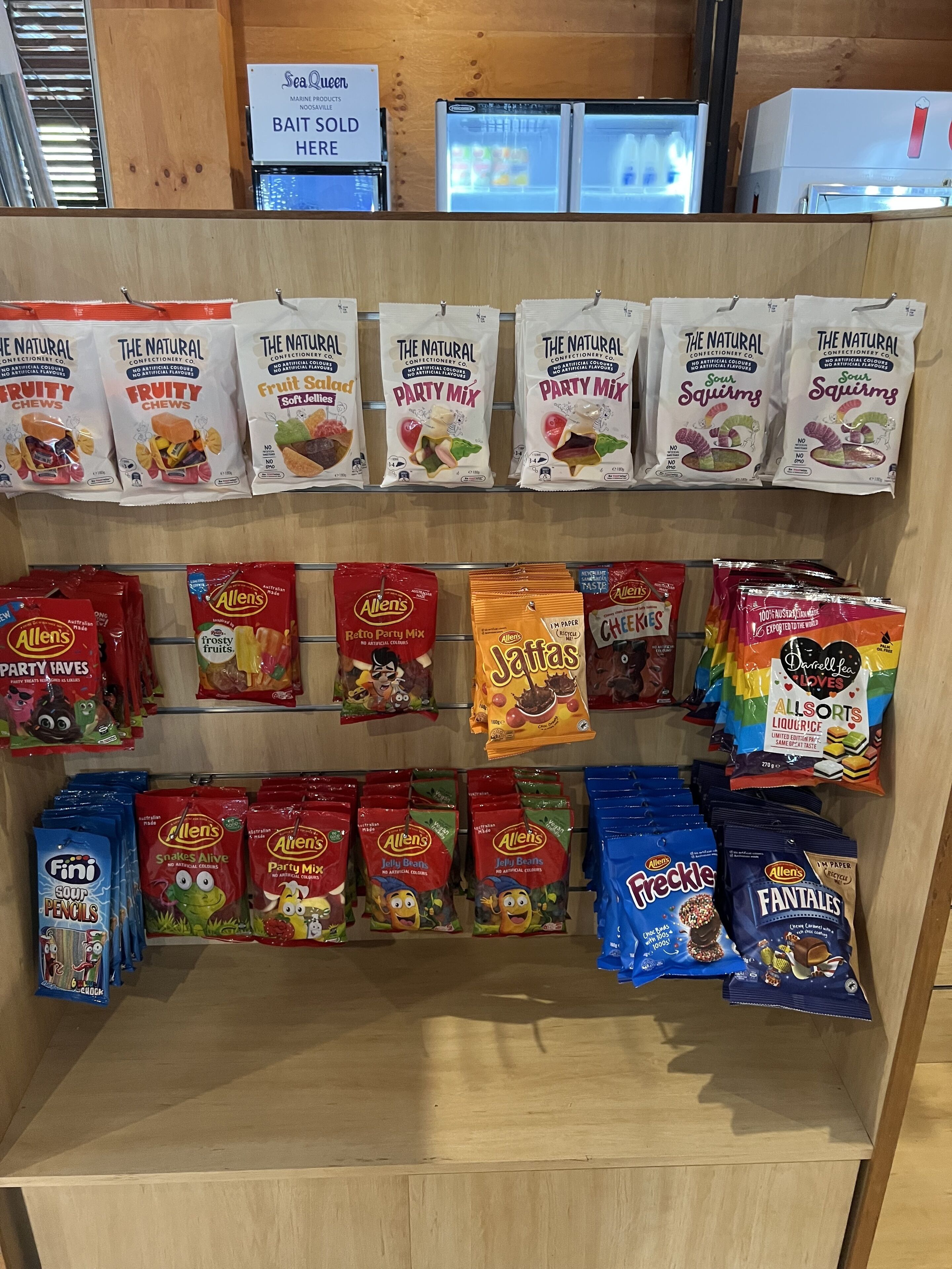 A candy display with various brands and flavors.