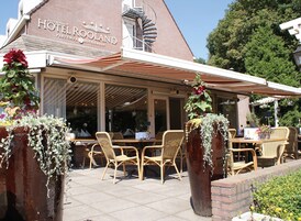 A restaurant with outdoor seating, wicker chairs, and a covered patio area.