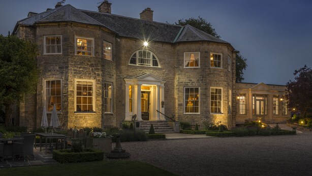 A stone building with a symmetrical facade, large windows, and a central entrance with steps. - Washingborough Hall Hotel (Lincoln)