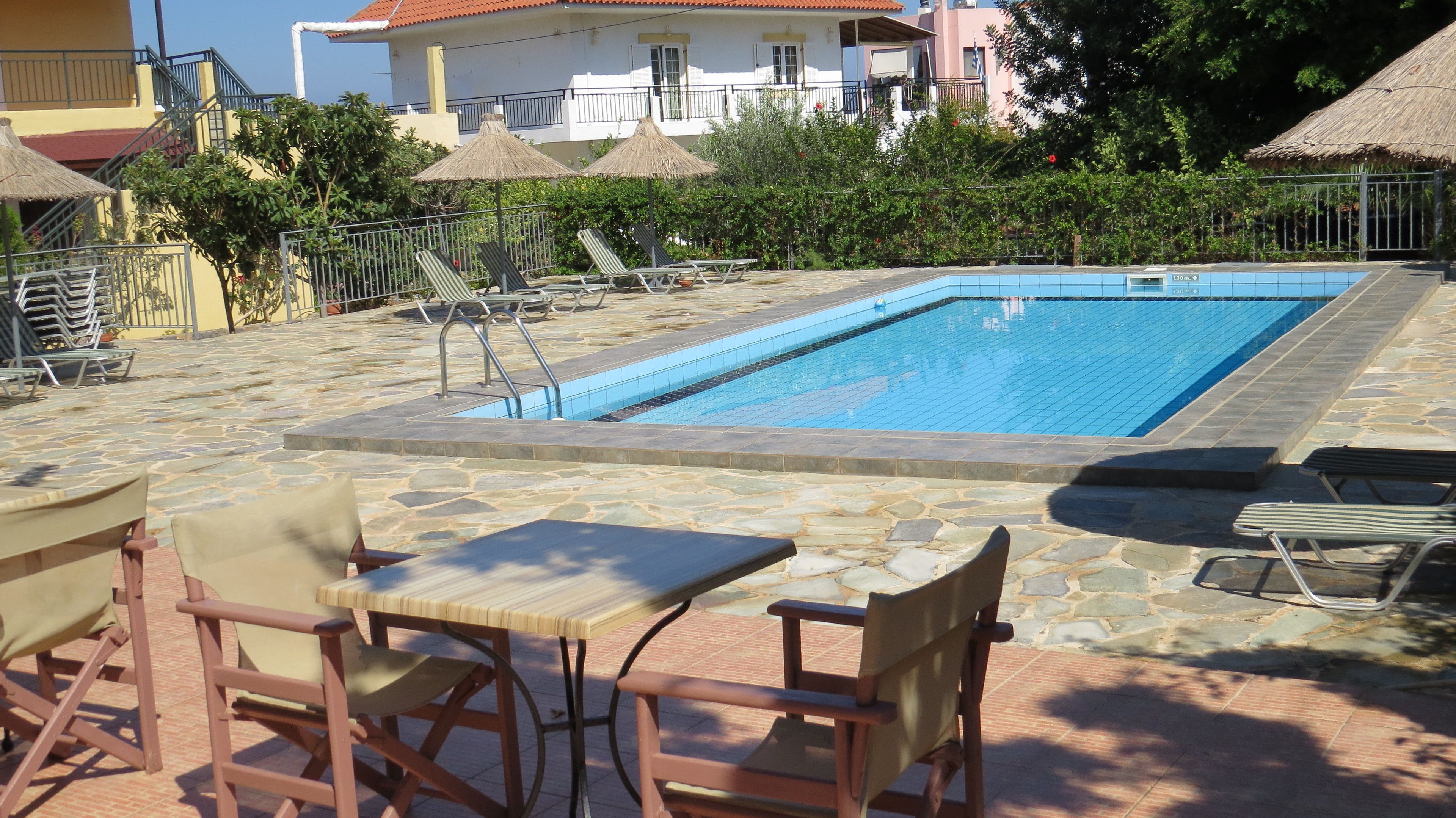 Seasonal outdoor pool, open 8:00 AM to 8:00 PM, pool umbrellas