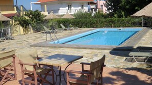 Seasonal outdoor pool, open 8:00 AM to 8:00 PM, pool umbrellas