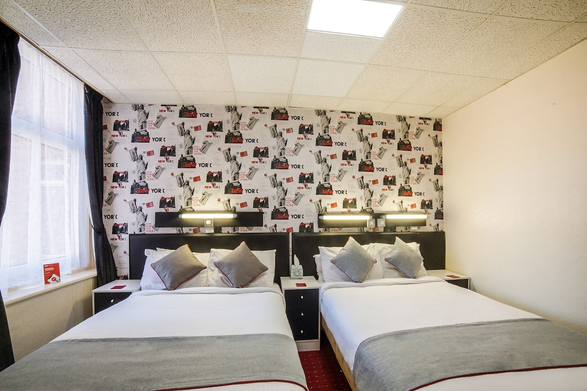 Deluxe Quadruple Room, 2 Queen Beds | Iron/ironing board (on request), WiFi (free)