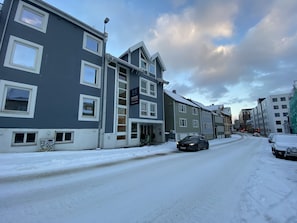 Explore the charming streets of Trømsø, lined with a mix of architectural styles.