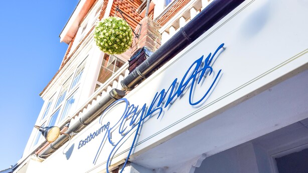 A building with a sign that reads "Eastbourne."