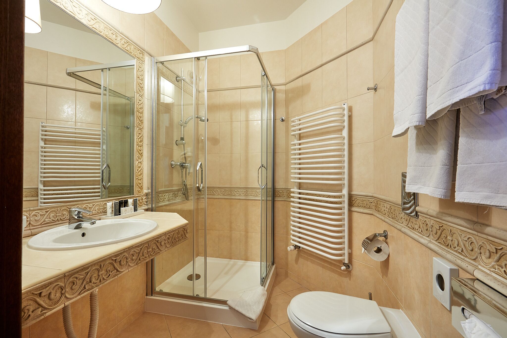 shower, designer toiletries, hair dryer, towels