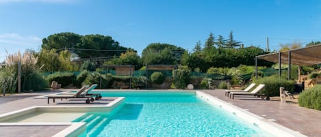 Seasonal outdoor pool, open 9:00 AM to 7:00 PM, sun loungers