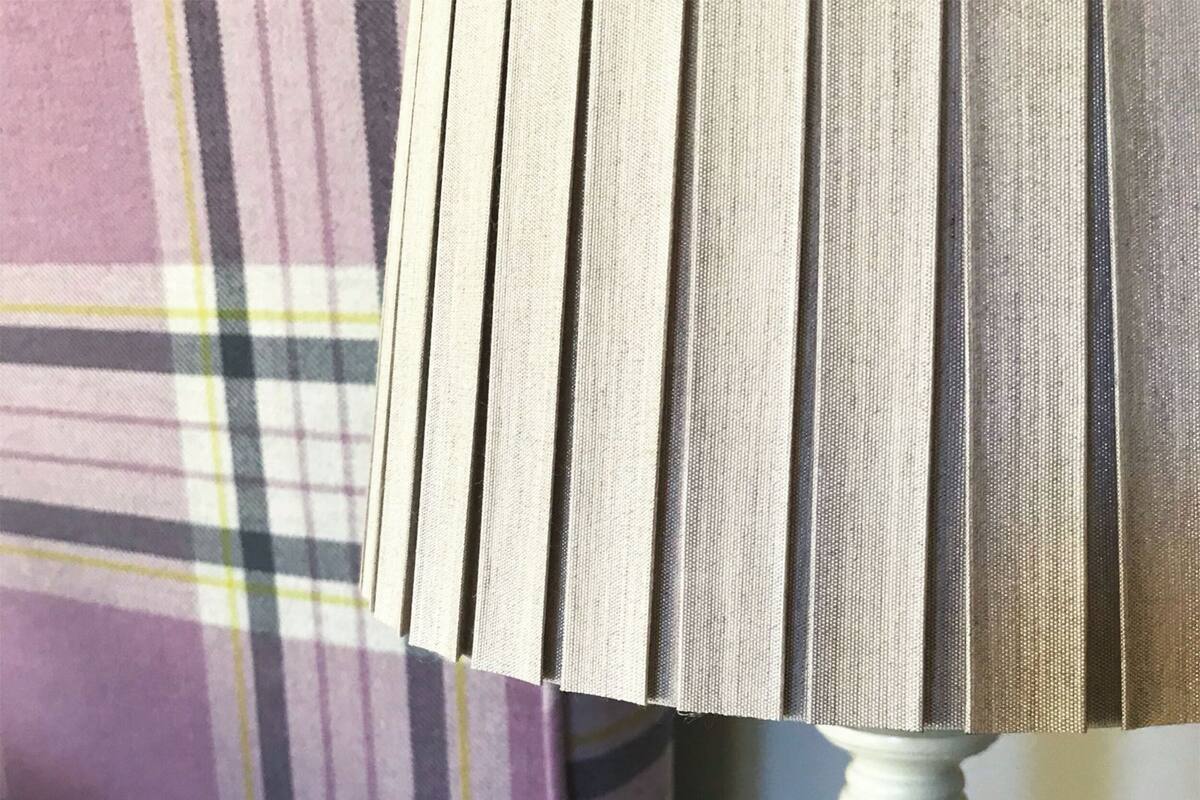 A close-up of a fabric with a plaid pattern.