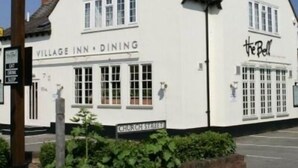 A white building with a sign reading "Village Inn - Dining" and another sign saying "The Bell". - The Bell (Pershore)