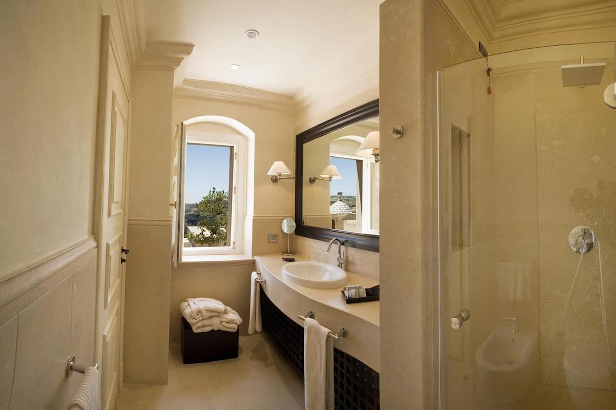 suite | bathroom | combined shower/bathtub, designer toiletries, hair dryer, bathrobes