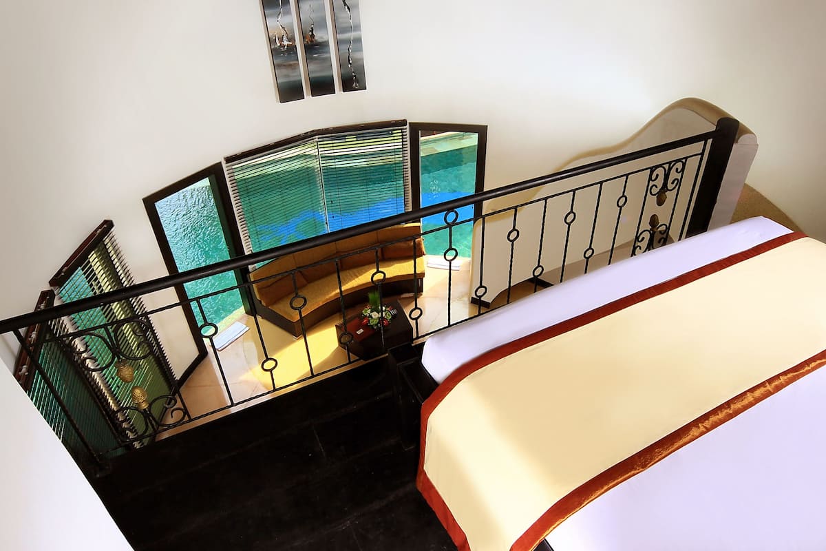 Villa, 1 Bedroom, Lagoon View | 1 bedroom, minibar, in-room safe, desk