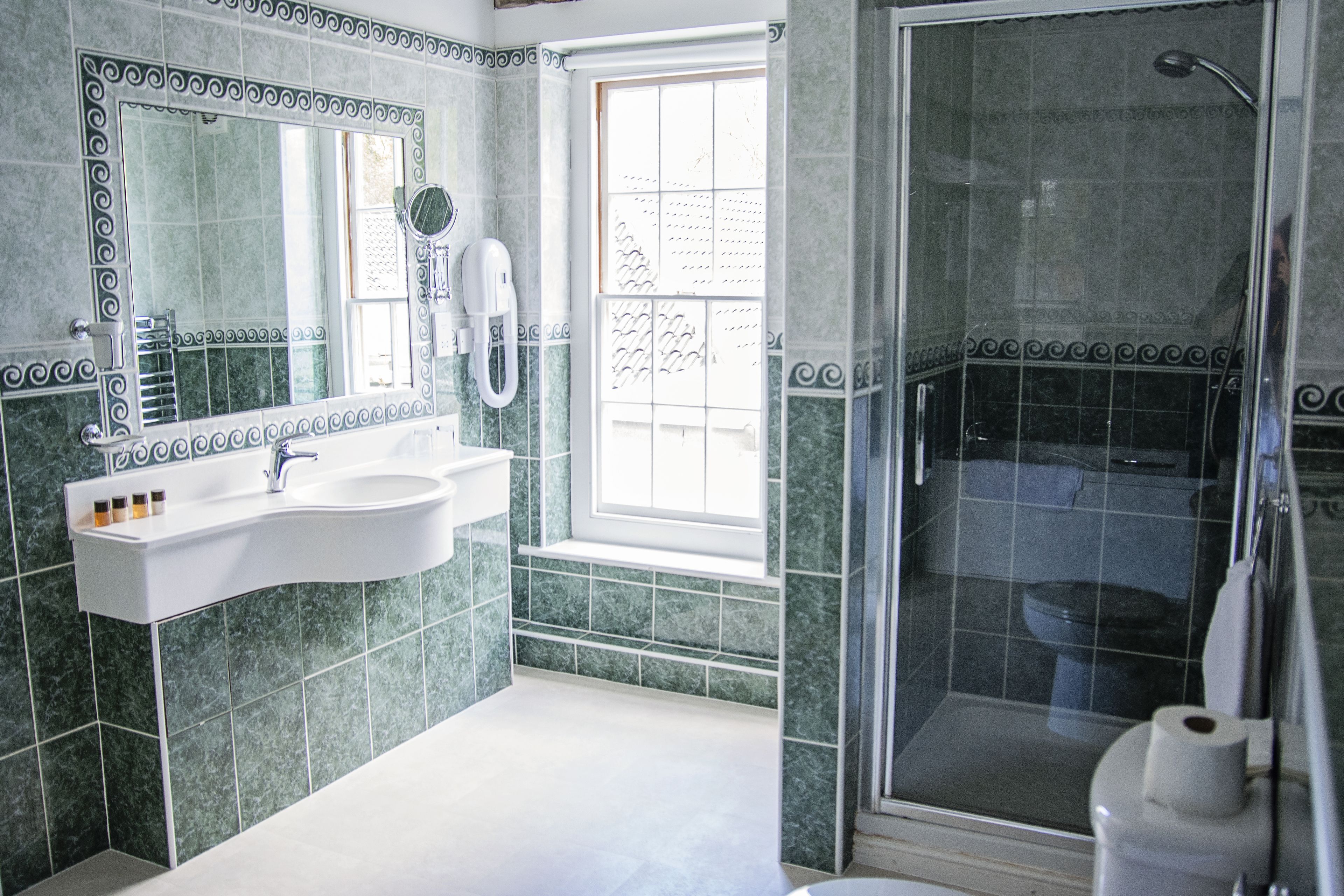 four poster king room | bathroom | free toiletries, hair dryer, towels, soap