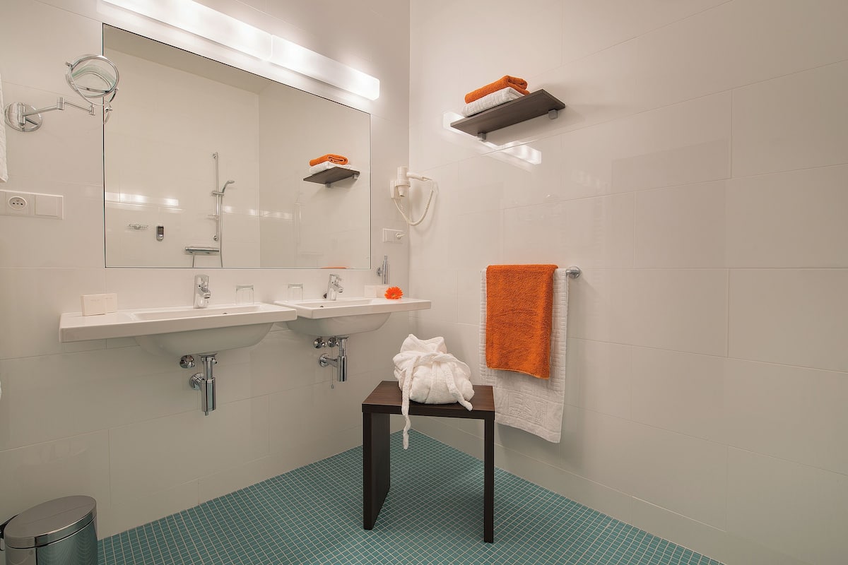 combined shower/bathtub, free toiletries, hair dryer, bathrobes