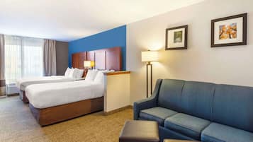 Premium bedding, desk, laptop workspace, blackout curtains