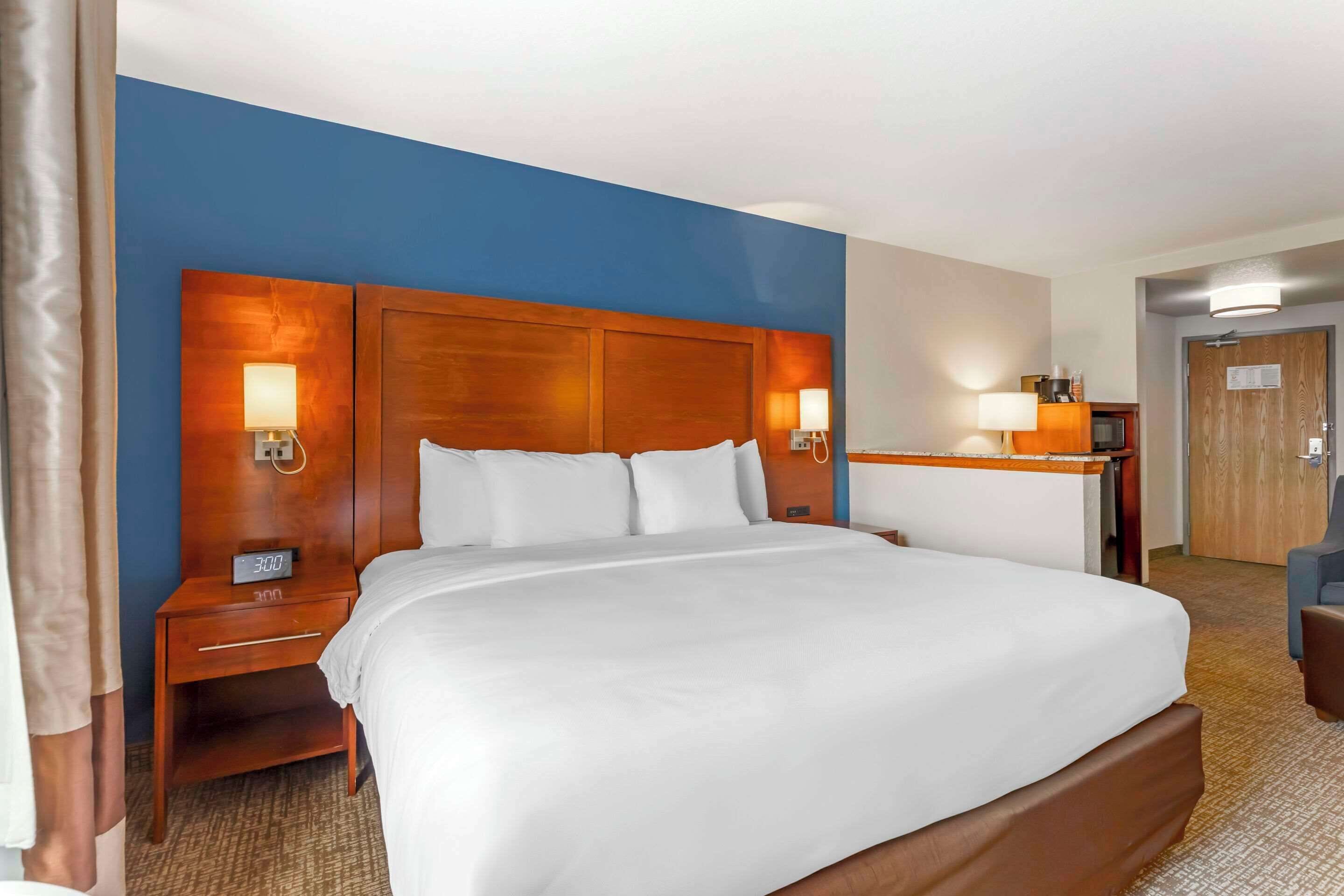 premium bedding, desk, laptop workspace, blackout curtains