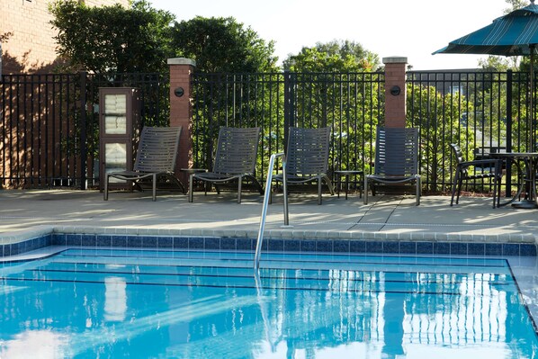 Outdoor pool, open 6:00 AM to 10:00 PM, pool loungers