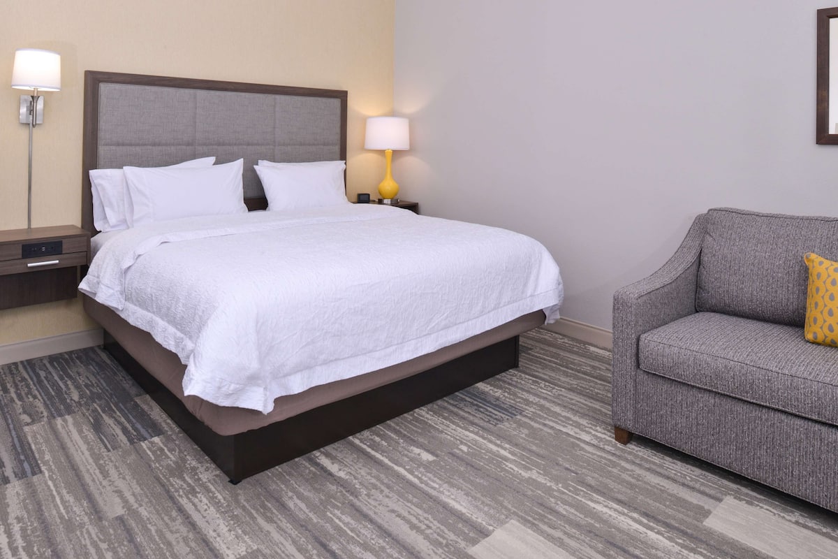 Premium bedding, desk, laptop workspace, blackout curtains