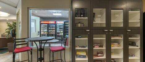 A lending locker with a table and chairs in the foreground.
