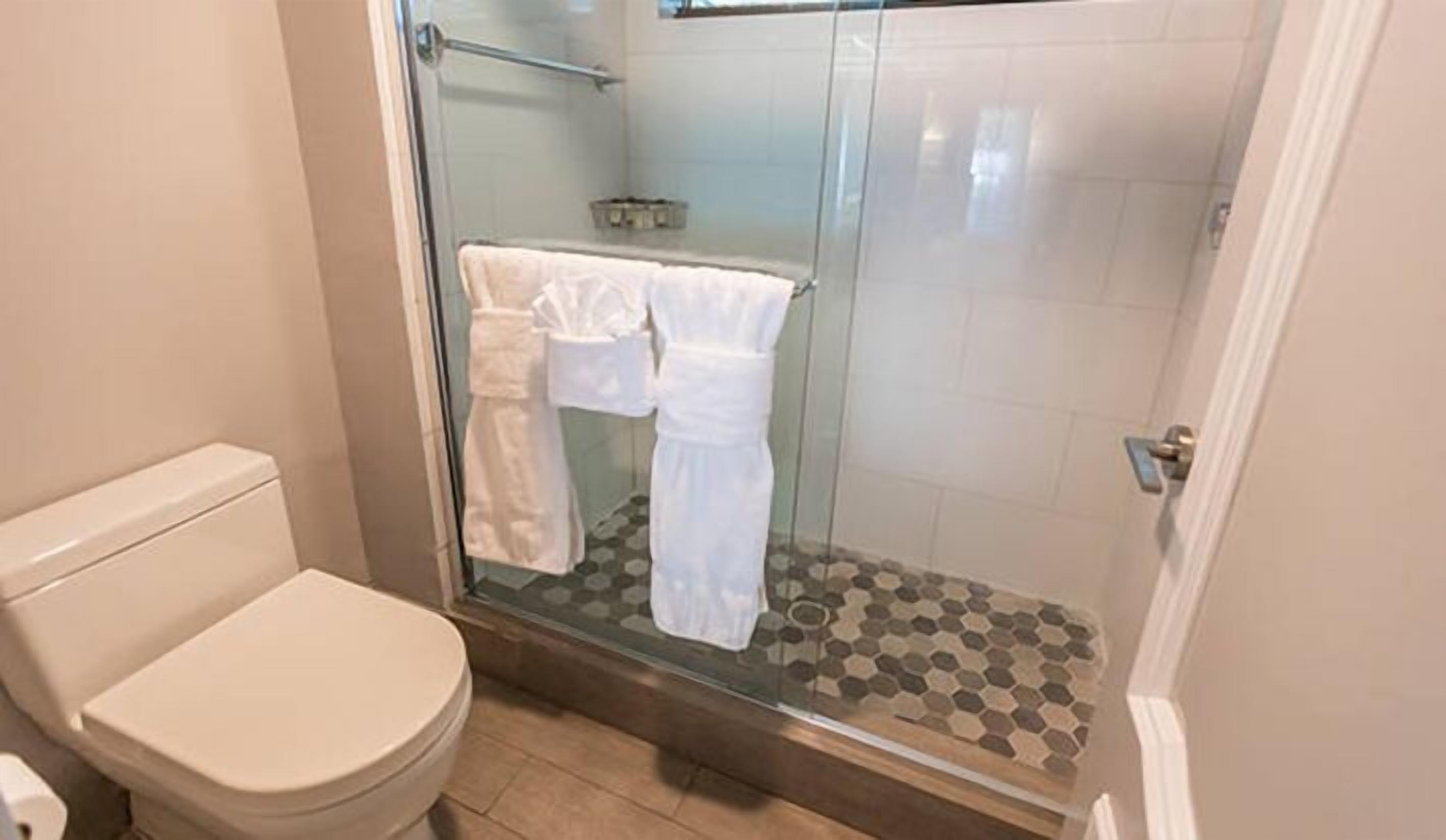 Bathroom | Shower, rainfall showerhead, designer toiletries, hair dryer