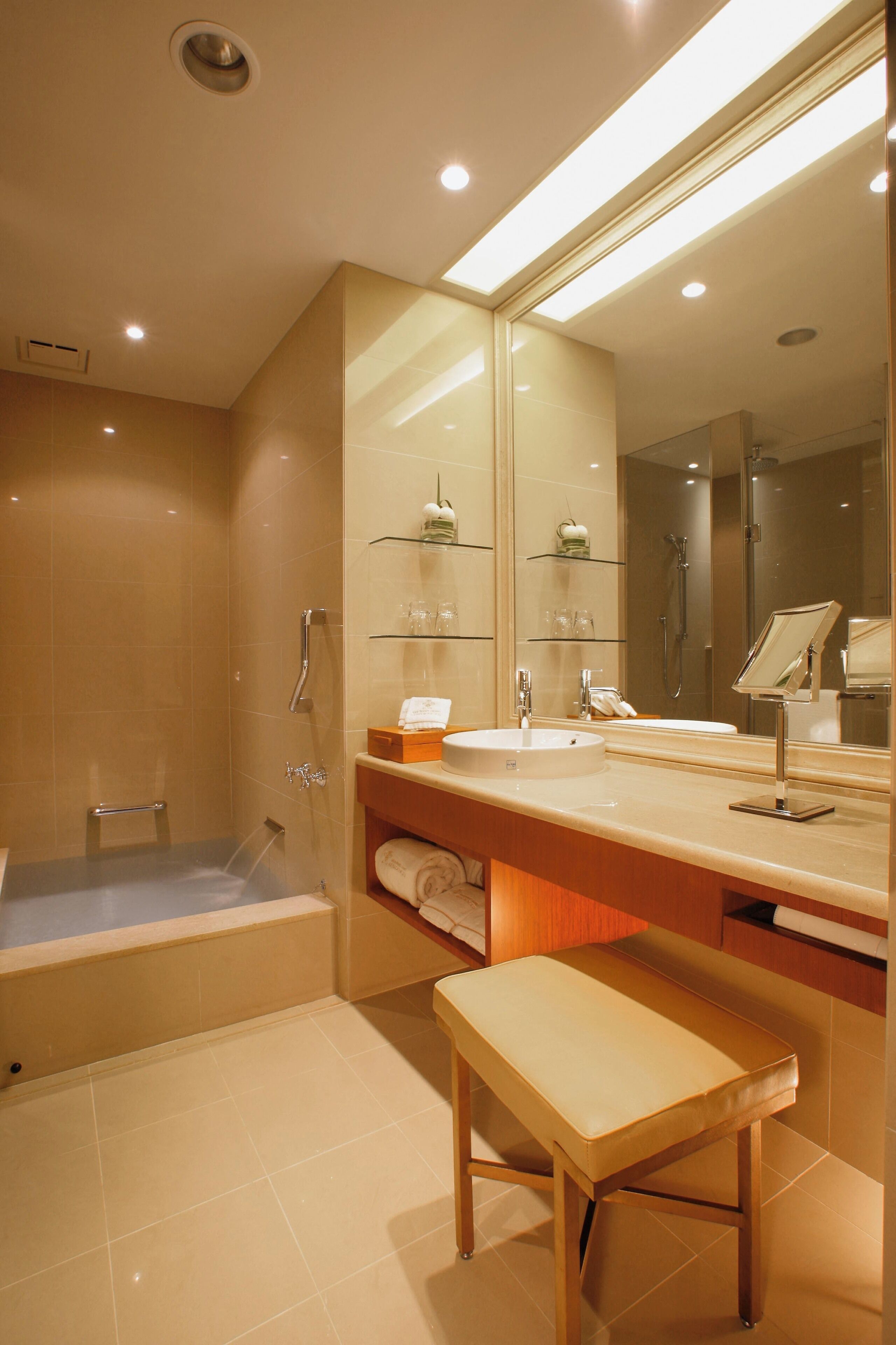 separate bathtub and shower, deep-soaking bathtub, rainfall showerhead
