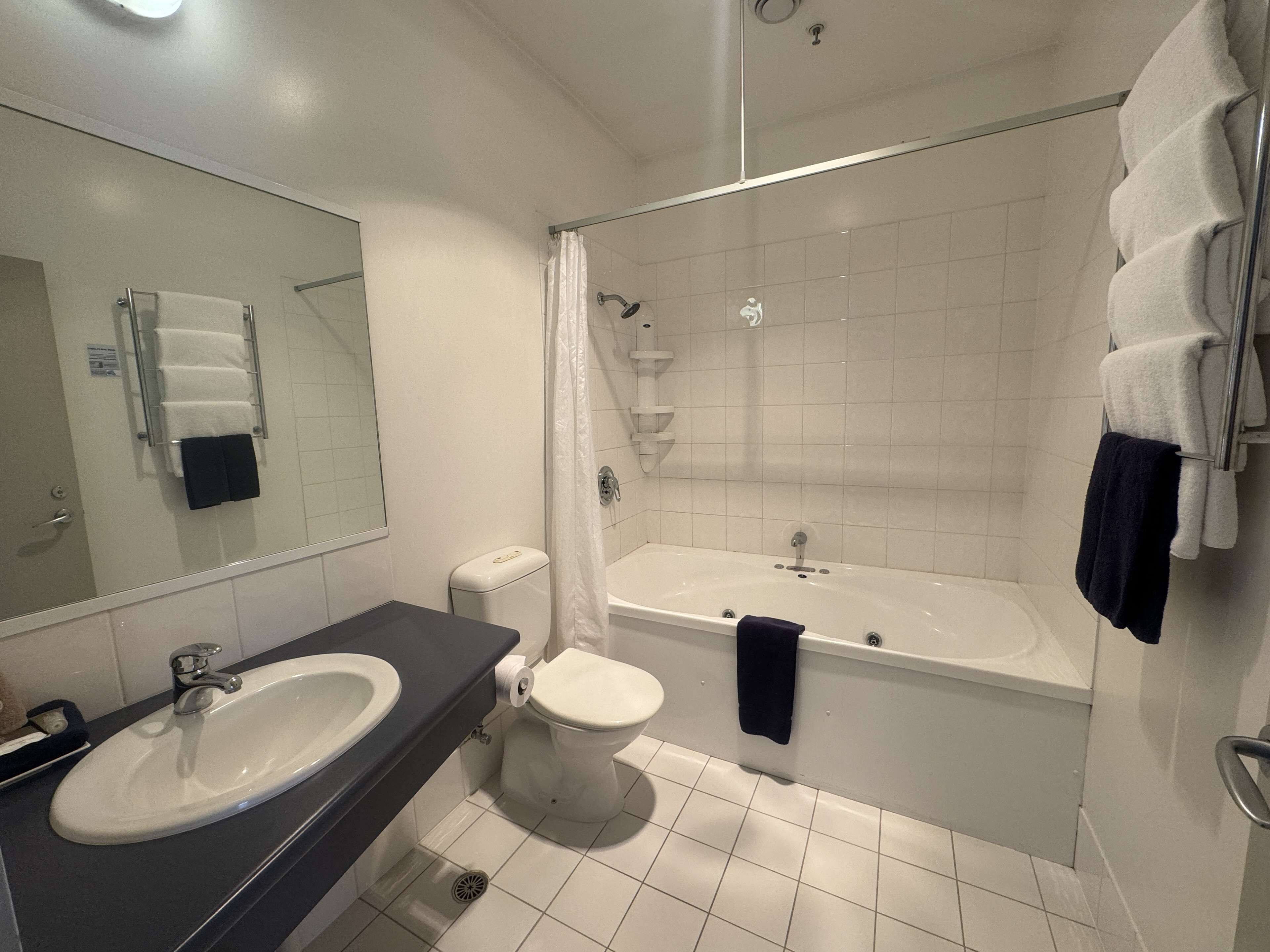 suite, 1 king bed, non smoking, balcony | bathroom | free toiletries, hair dryer, towels