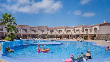 Seasonal outdoor pool, open 9:00 AM to 7:00 PM, pool umbrellas