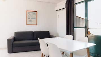 Departamento, 1 habitación | Área de sala de estar | Televisión
