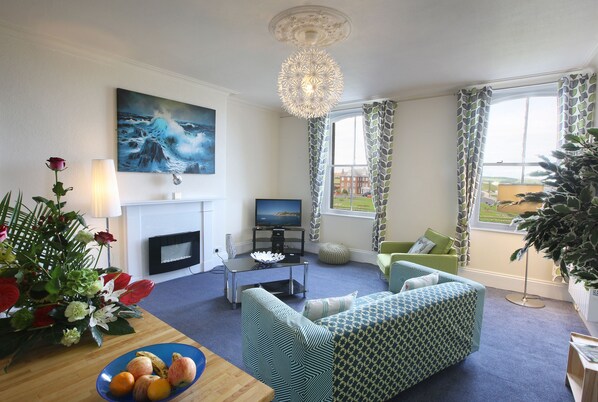 Apartment, Kitchen, Sea View | Living area | Flat-screen TV