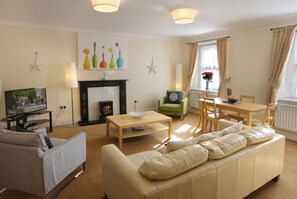 Family Apartment, Kitchen | Living area | Flat-screen TV