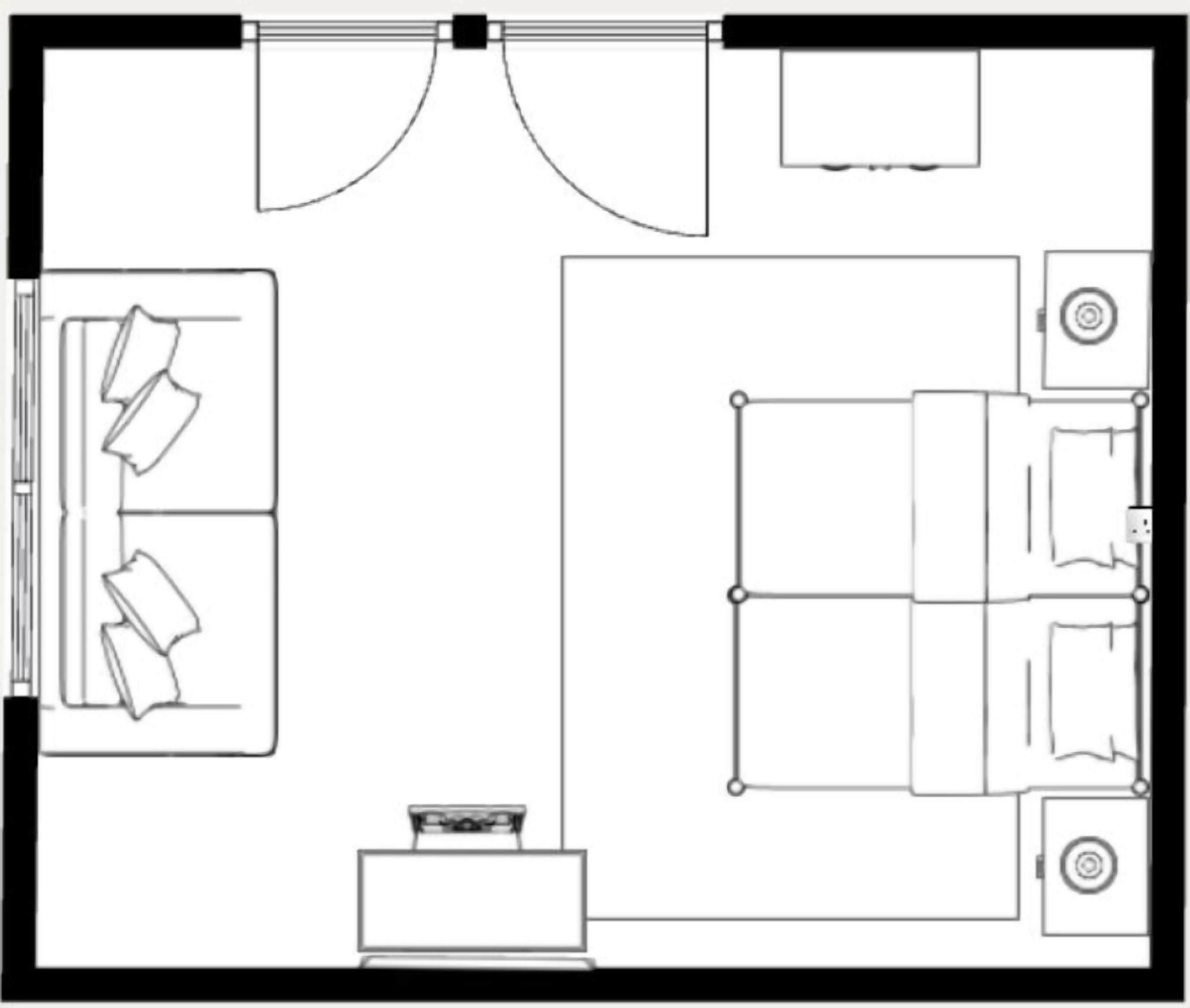 Indeling van een hotelkamer met een bed, nachtkastje en een zithoekje.