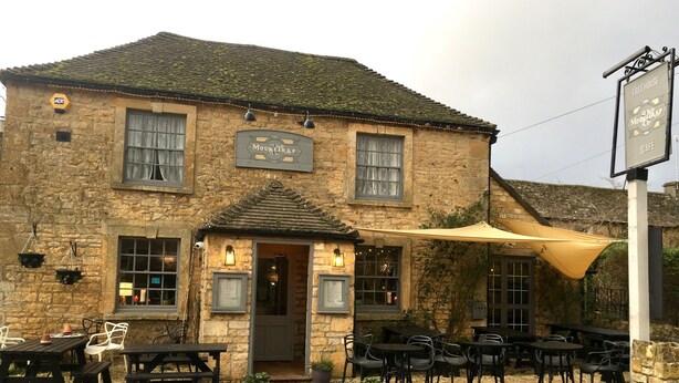A stone building with a sign reading "The Mouse Trap Café". - The Mousetrap Inn (Cheltenham)