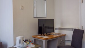 A small office space with a desk, chair, and a coffee maker. - The Buttery Hotel (Oxford)