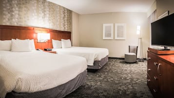 Roupas de cama premium, escrivaninha, espaço de trabalho para notebook