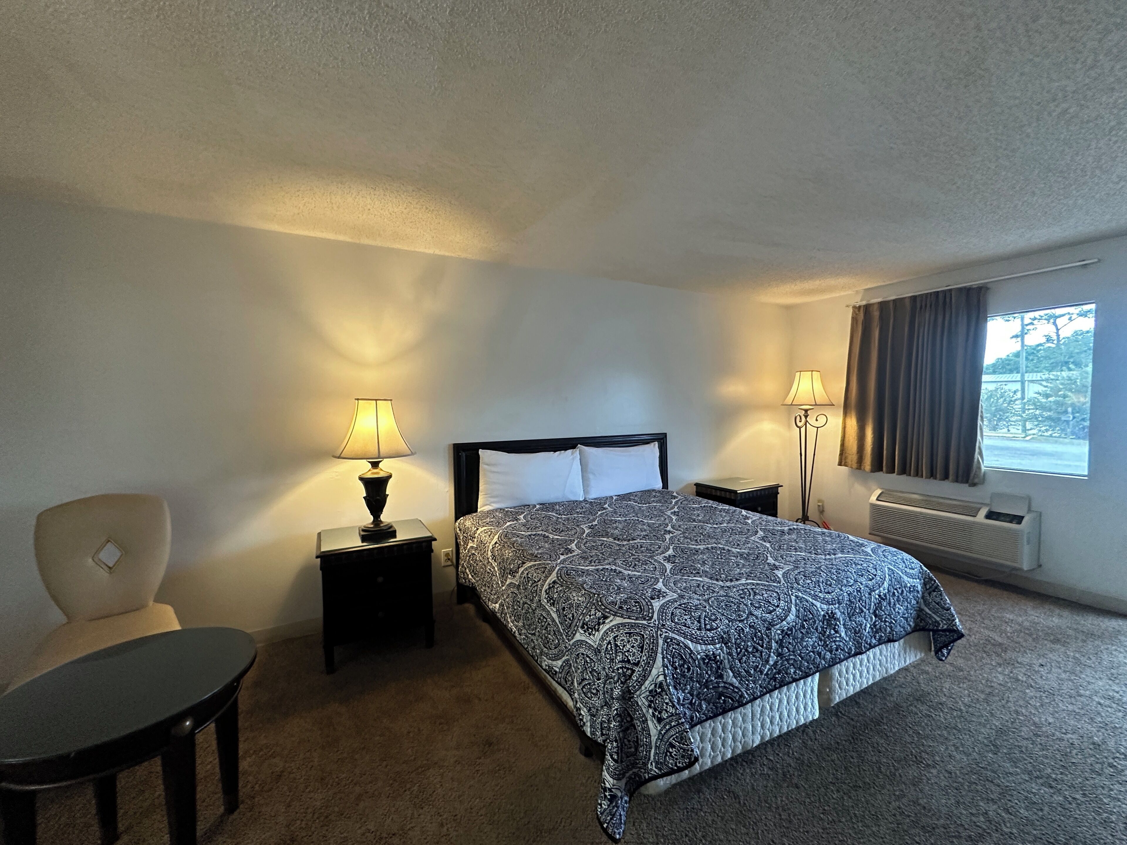 Desk, iron/ironing board, bed sheets