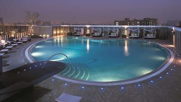 Outdoor pool, open 7:00 AM to 9:30 PM, pool umbrellas, sun loungers