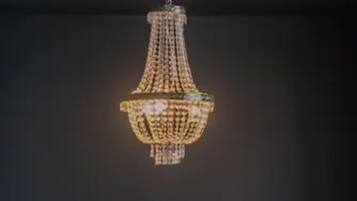 A chandelier with a geometric design hanging from the ceiling.